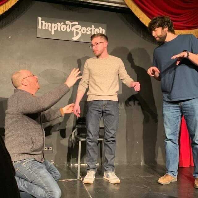 Ross having some fun doing improv comedy